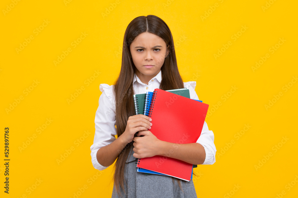 School child with book. Learning and education. Angry teenager schoolgirl, upset and unhappy negative emotion. School child with book. Learning and education. Angry teenager schoolgirl, upset and unhappy negative emotion.