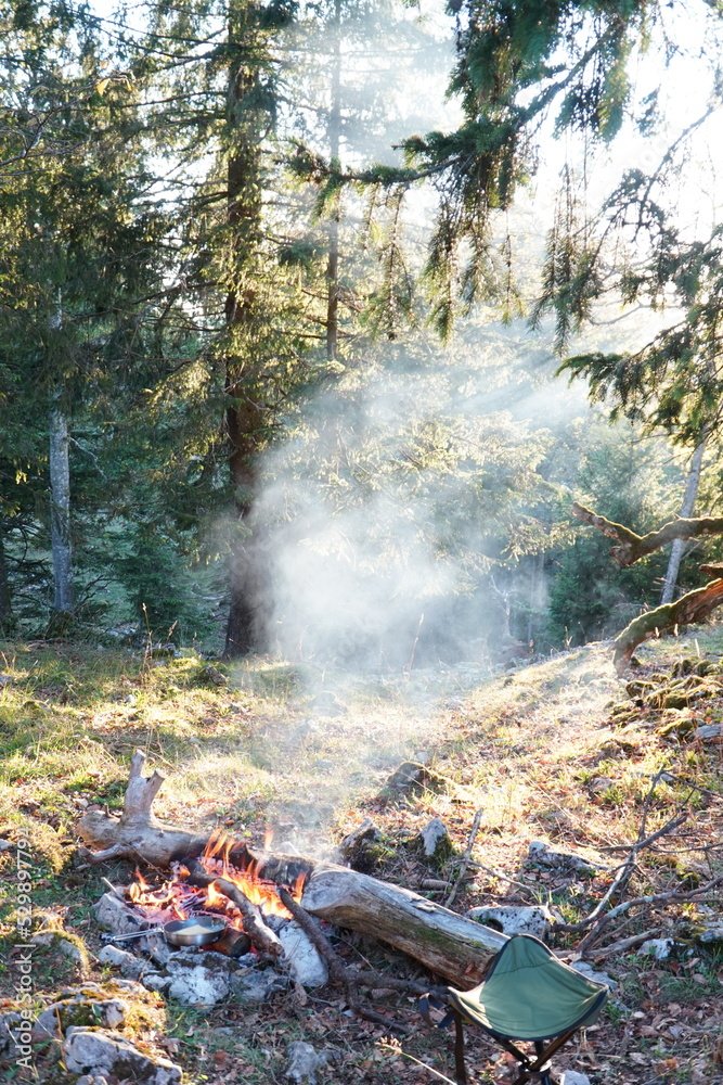 Cooking on a Campfire during sunset Cooking on a Campfire during sunset