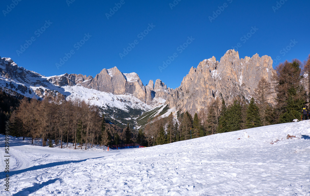 mountains in val di fassa in winter, with snow