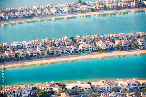 The Palm Jumeirah. Holidays villas and luxury hotels view at sunset. Dubai, UAE