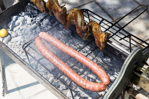 Typical Greek barbeque, with sausage and chicken