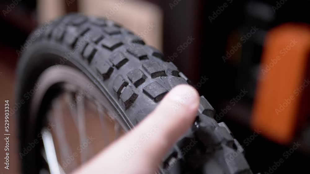 Rotation of a Black Rubber Bicycle Wheel with Spokes in the