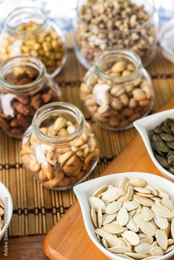 Assortment of nuts on rustic wood table Assortment of nuts on rustic wood table