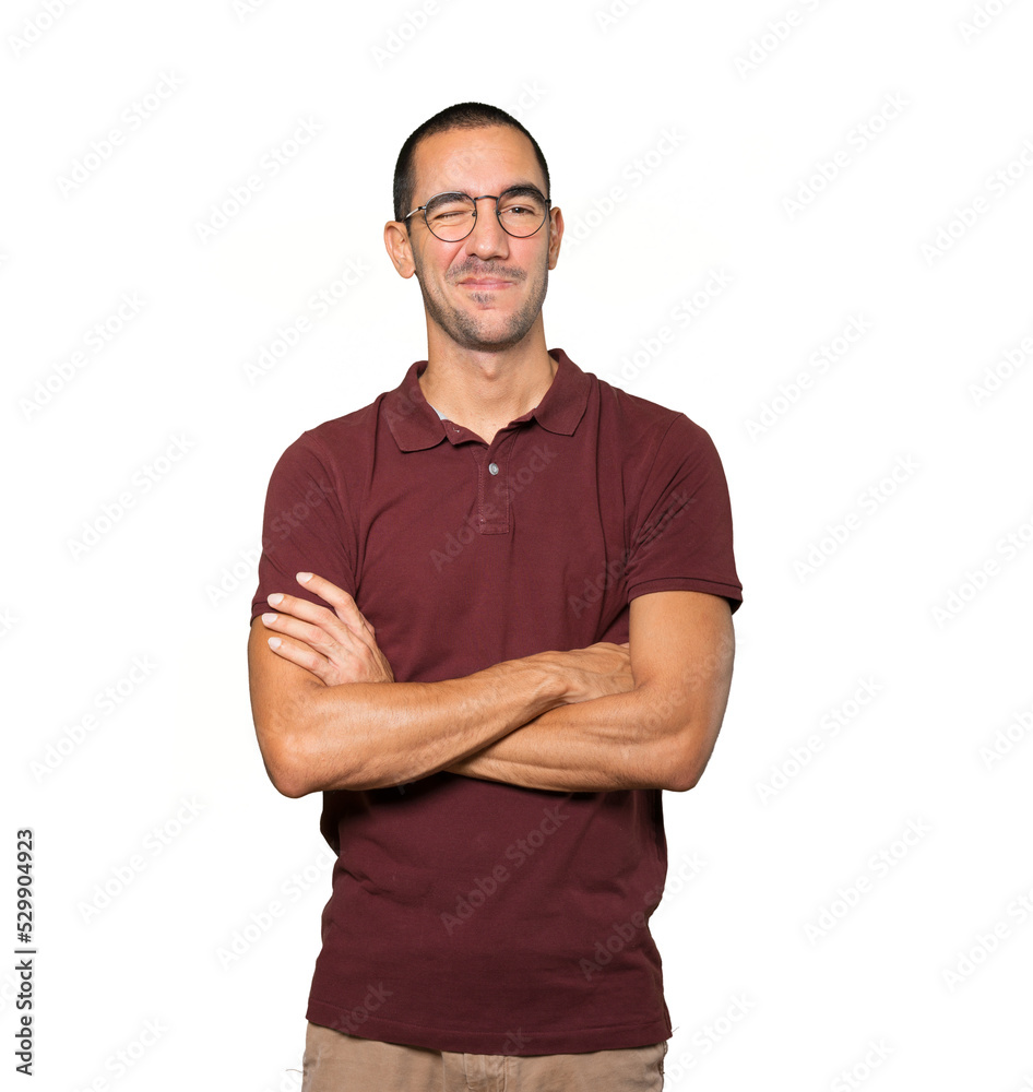 Friendly young man winking an eye Friendly young man winking an eye