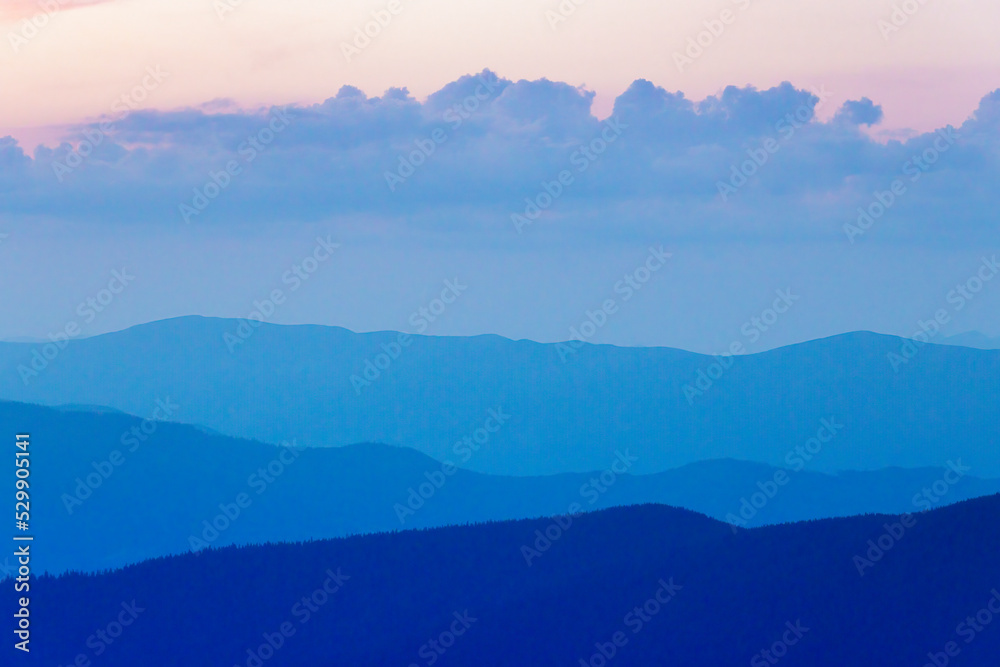 Obraz premium Misty mountain silhouettes.