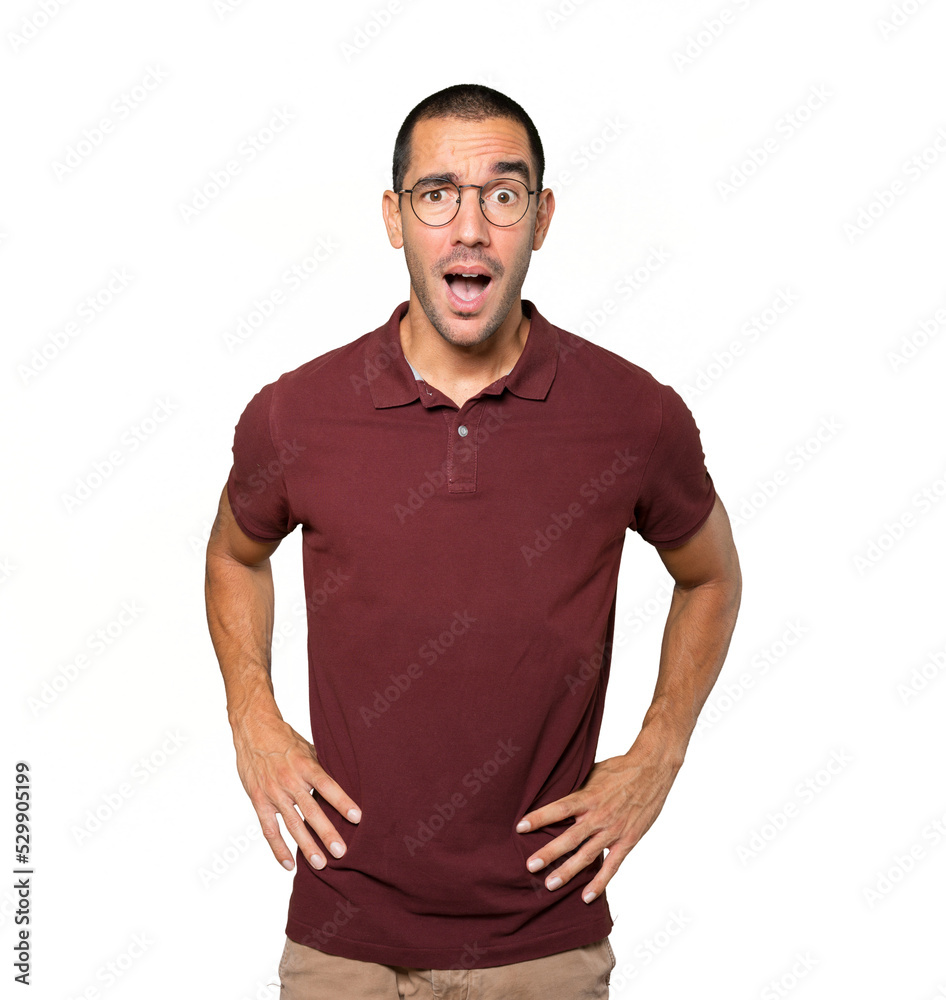 Amazed young man looking up gesture