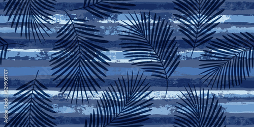 Tropical pattern  palm leaves seamless vector floral background. Exotic plant on blue stripes print illustration. Summer nature jungle print. Leaves of palm tree on paint lines. ink brush strokes