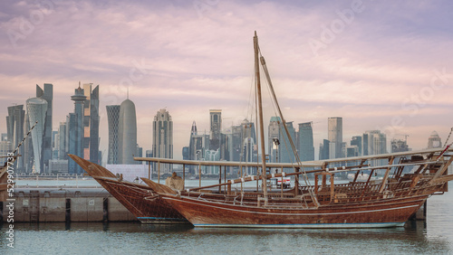 traditional dhows at Qatar corniche, with Qatar skyline in the background
