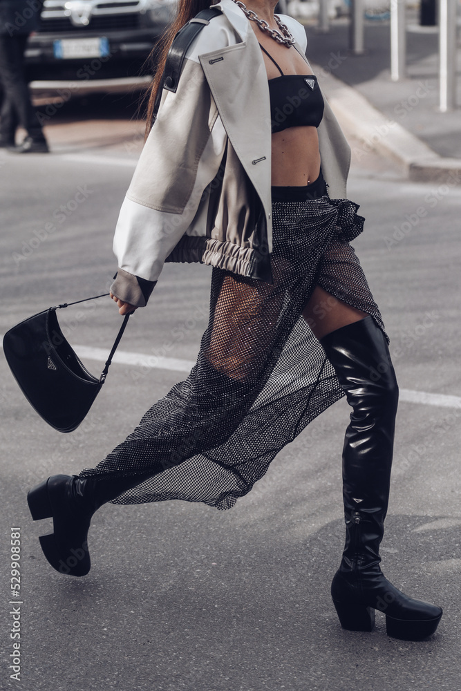 Street style, woman wearing Prada outfit. Stock Photo