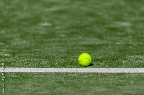 Tennis ball on a tennis court. Horizontal sport theme poster, greeting cards, headers, website and app