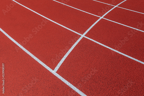 Red track and field lanes. Running lanes at a track and field athletic center. Horizontal sport theme poster, greeting cards, headers, website and app