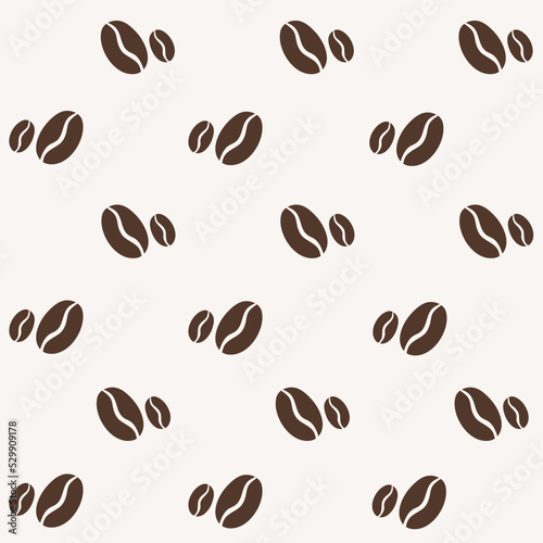 Seamless pattern with brown coffee beans on beige background in flat style.