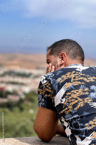 Portrait of a man looking away at the city