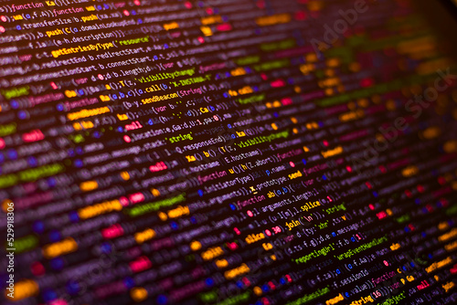 Code background. Compressed colored javascript code photo