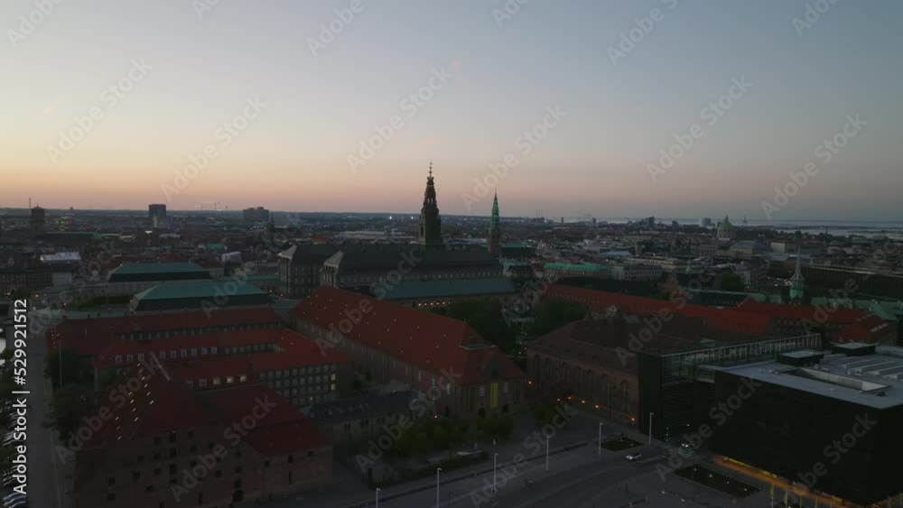 Aerial view of complex of buildings around Christiansborg palace at dusk. Panoramic view of evening city. Copenhagen, Denmark
