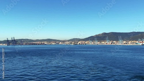 VESSEL DEPARTING ALGECIRAS, SPAIN, It's located in the southern end of the Iberian Peninsula, near the Strait of Gibraltar, it is the largest city on the Bay of Gibraltar (Spanish: Bahía de Algeciras)