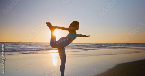 woman practice yoga on beach