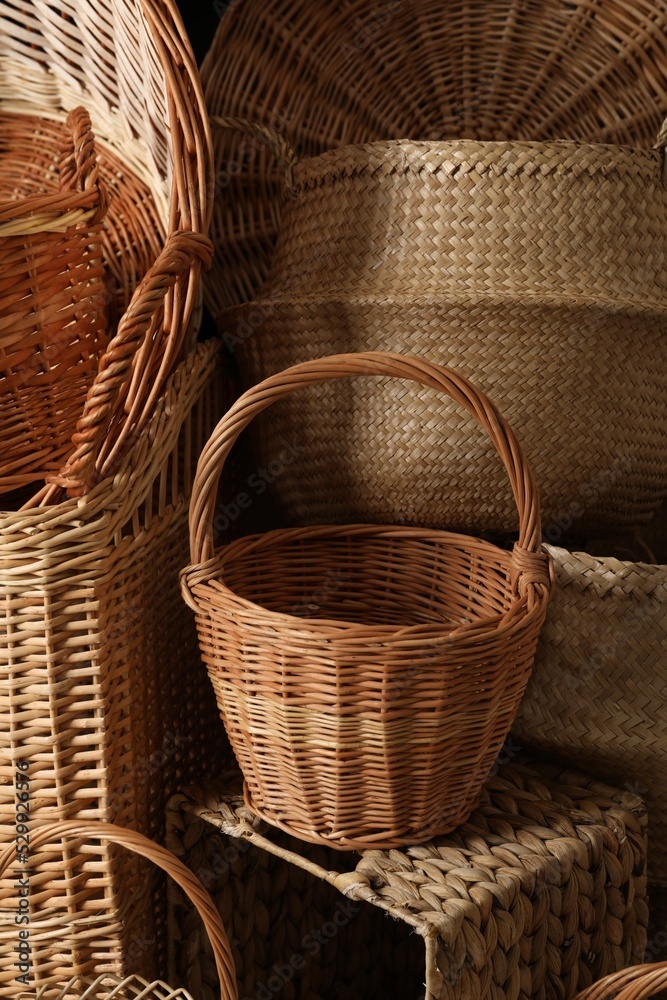 Many different wicker baskets made of natural material as background, closeup Many different wicker baskets made of natural material as background, closeup