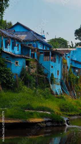 Blue houses of Jodipan quarter called thee rainbow village at Malang photo