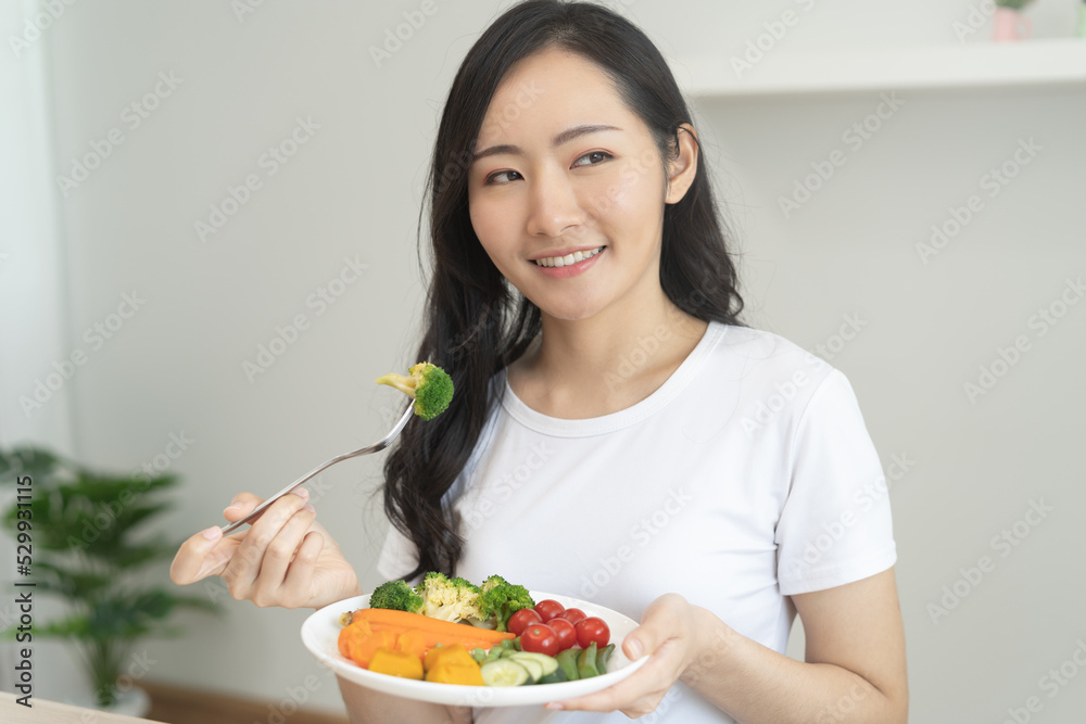 young female planning menu to eat ketogenic diet during weight loss program.