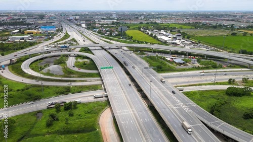 Beautiful aerial view to the car traffic transportation on multi-level highway in Thailand. Direct view from above to the road traffic in a big city
