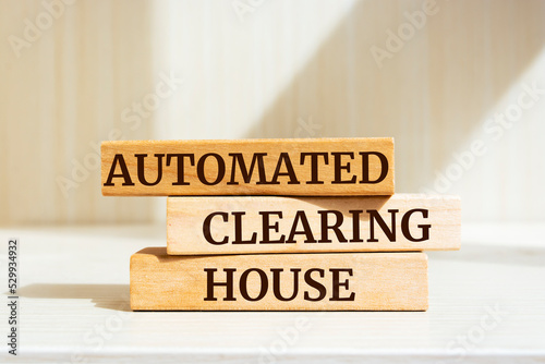 Wooden blocks with words 'Automated Clearing House'. photo
