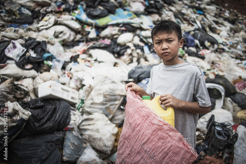 Child labor. Children are forced to work on rubbish. Poor children collect garbage. Poverty, Violence children and trafficking concept,Anti-child labor, Rights Day on December 10.