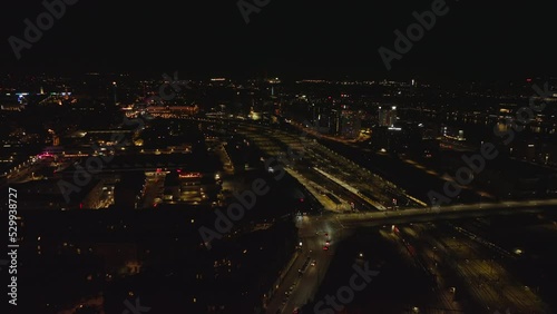 Wallpaper Mural Fly above night city. Aerial view of illuminated buildings and transport infrastructure, road and railway tracks. Copenhagen, Denmark Torontodigital.ca