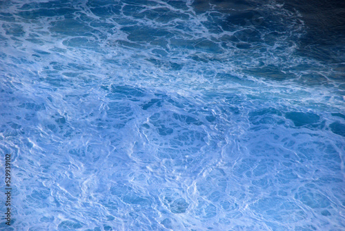 Blue sea marine ocean seascape tropical huge wave on blurred background. Seascape blue ocean white wave motion outdoor. Aqua marine huge wave sea summer background. Paradise turquoise water landscape