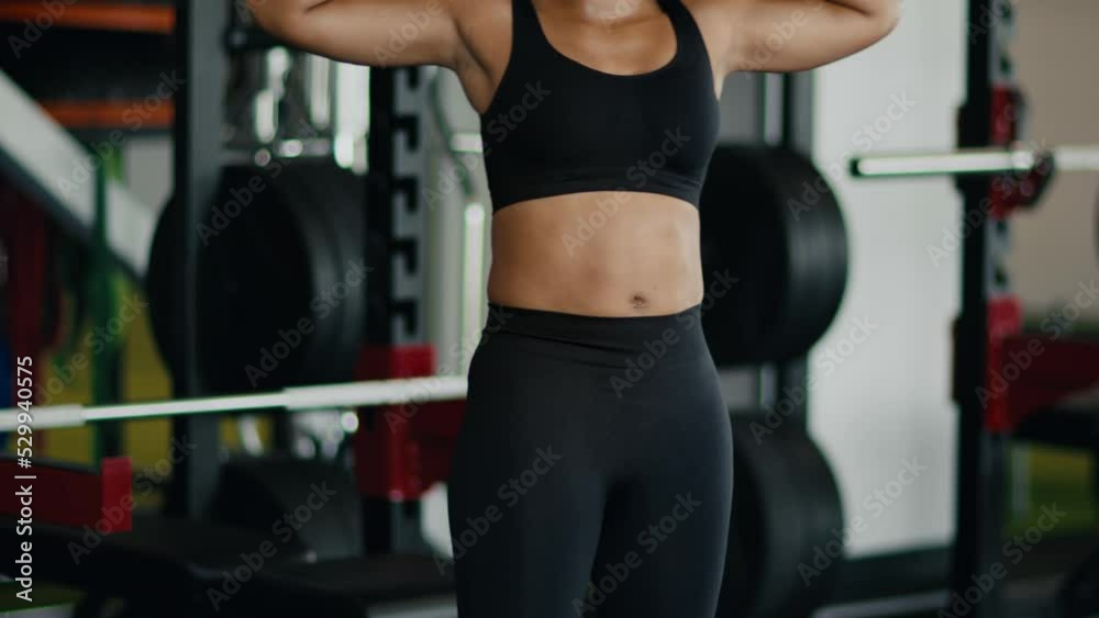 Sporty body concept. Unrecognizable active african american woman exercising at gym, practicing flexibility, empty space Sporty body concept. Unrecognizable active african american woman exercising at gym, practicing flexibility, empty space