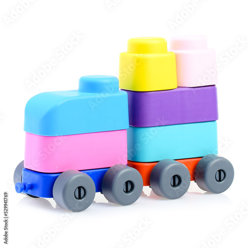 Plastic children's constructor-a steam train, isolated on a white background. Colorful toy train. Educational games for children. Construction and stacking