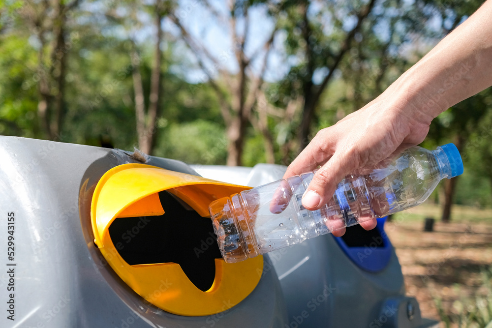 Please dispose of plastic bottle into the tank. A man throw rubbish in