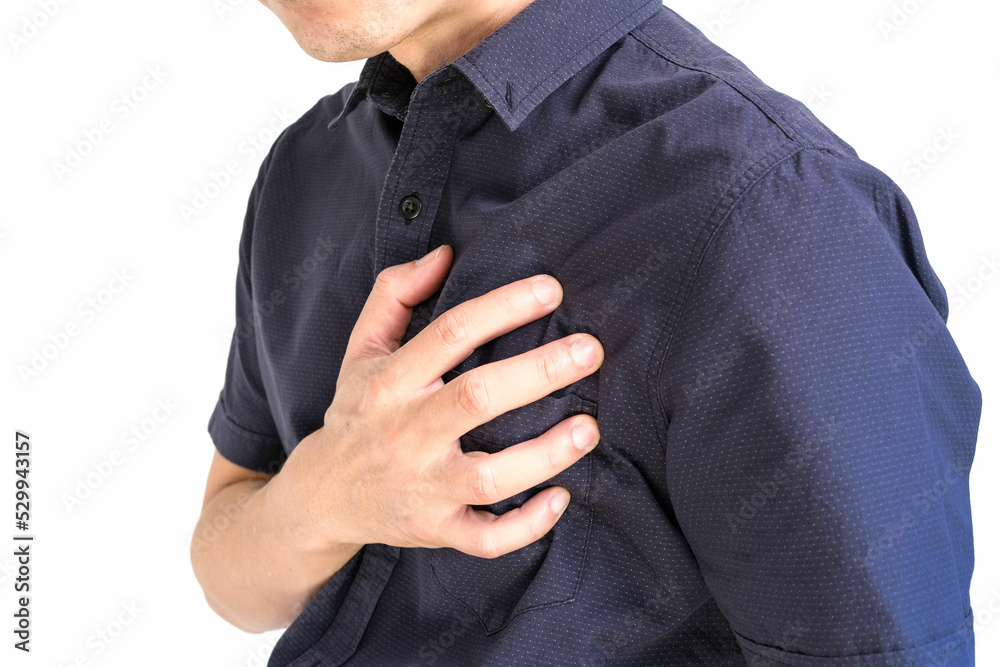 Man is sick and in pain and uses his hands to squeeze his chest He had