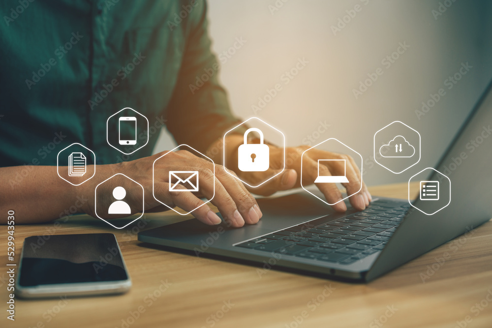 Naklejka premium Businessmen protecting personal data on laptop and virtual interfaces, user typing login and password, cyber security concept.