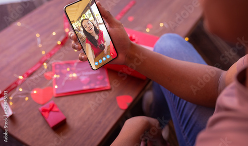 Biracial young woman online dating with african american boyfriend on valentine day