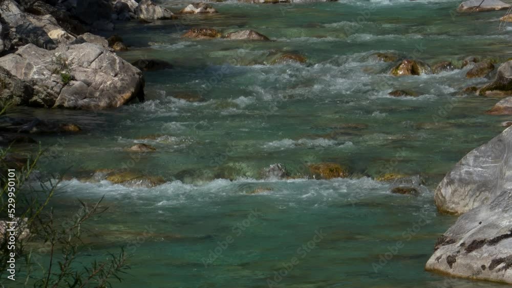 Mountain river with crystal emerald water streaming through stones, beautiful background Mountain river with crystal emerald water streaming through stones, beautiful background