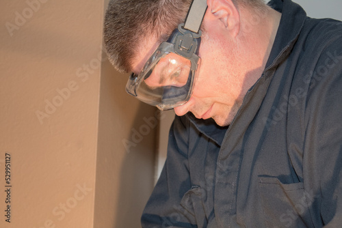 A Caucasian male wearing protective goggles photo