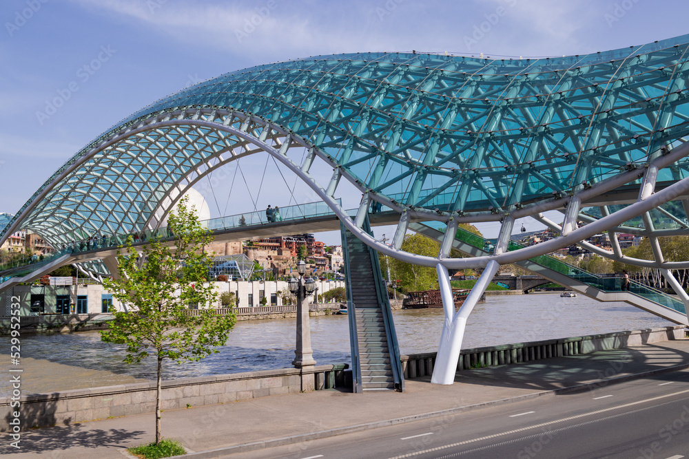 Bridge of Peace in Tbilisi across the Kura River. Historic city center. summer Bridge of Peace in Tbilisi across the Kura River. Historic city center. summer