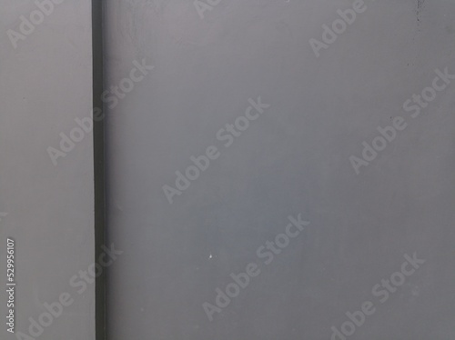 a photo of a gray building wall. the walls look clean