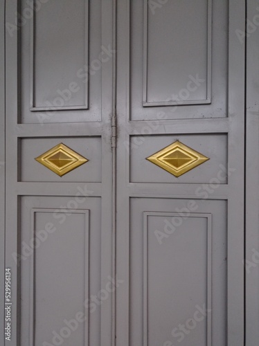 a photo of a door made of iron. gray