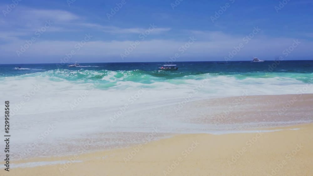 boats on the horizon line on the coast of Cabo San Lucas, Baja California. big waves and blue sea. 4K videos. boats on the horizon line on the coast of Cabo San Lucas, Baja California. big waves and blue sea. 4K videos.