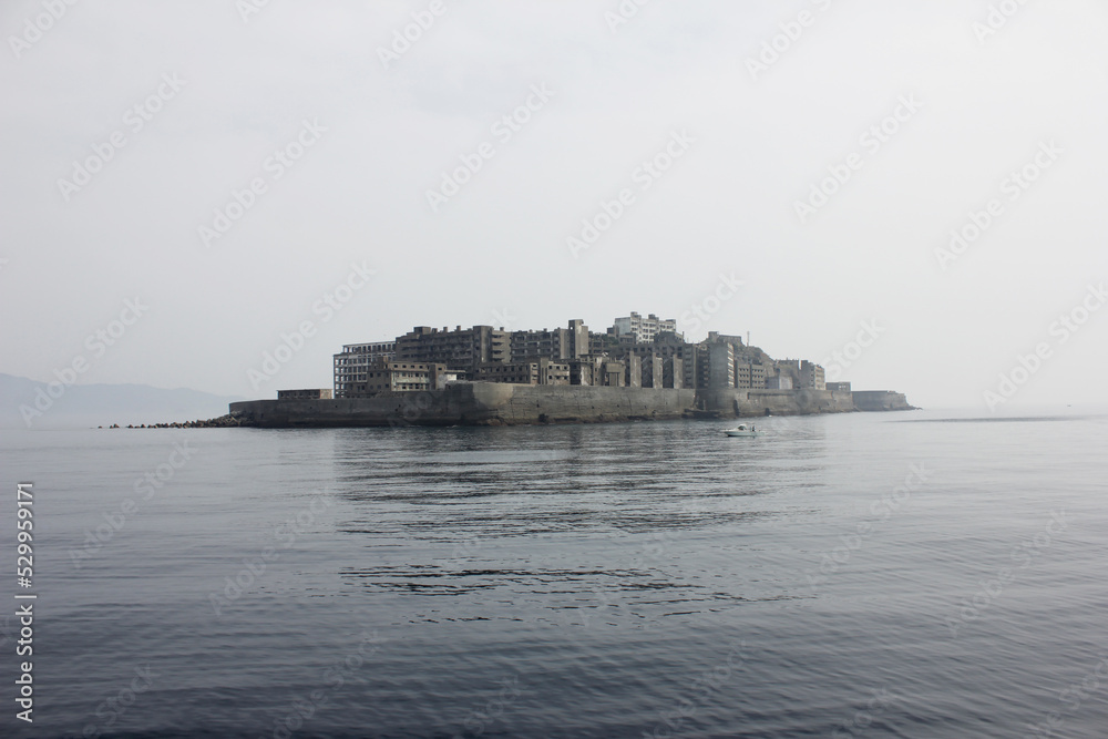 Battleship Island unique view from a distance. Ruins of Hashima Island Japan
