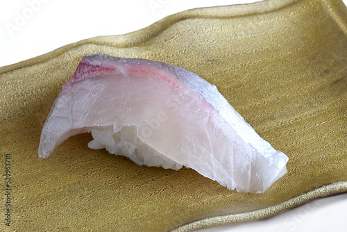 Striped jack Sushi Nigiri on gold plate-Japanese Food photo