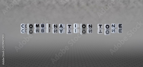 combination tone word or concept represented by black and white letter cubes on a grey horizon background stretching to infinity