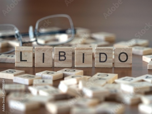 Tableau sur toile libido word or concept represented by wooden letter tiles on a wooden table with