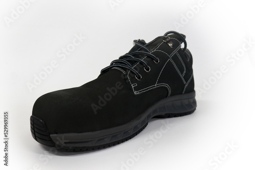 Black sports shoes for running or other sports and are also used for daily activities © Nur