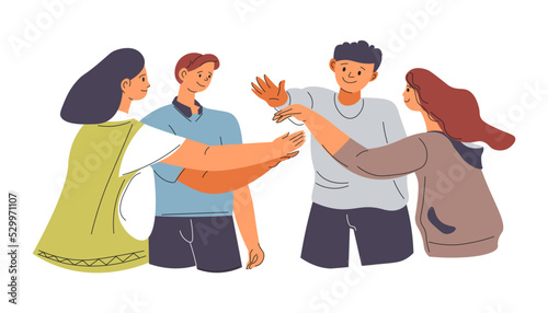 Team of young teenagers clasping hands, friends