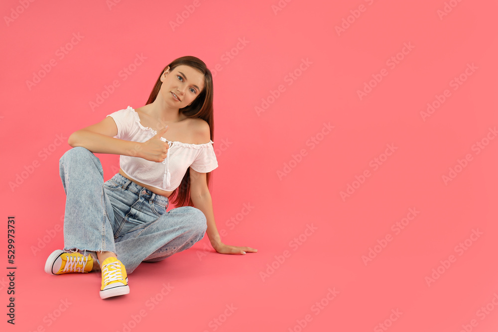 Concept of people, young woman on pink background Concept of people, young woman on pink background