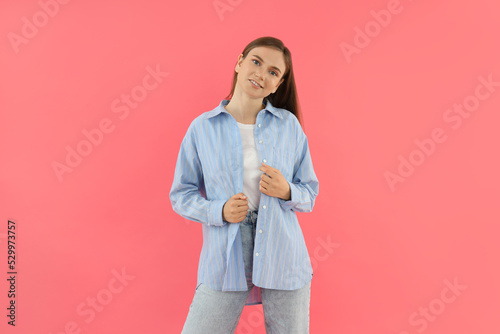 Concept of people, young woman on pink background
