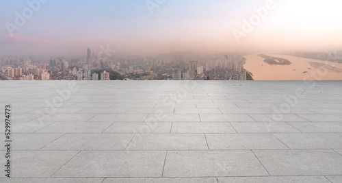 Empty floor tiles and city buildings background © 昊 周